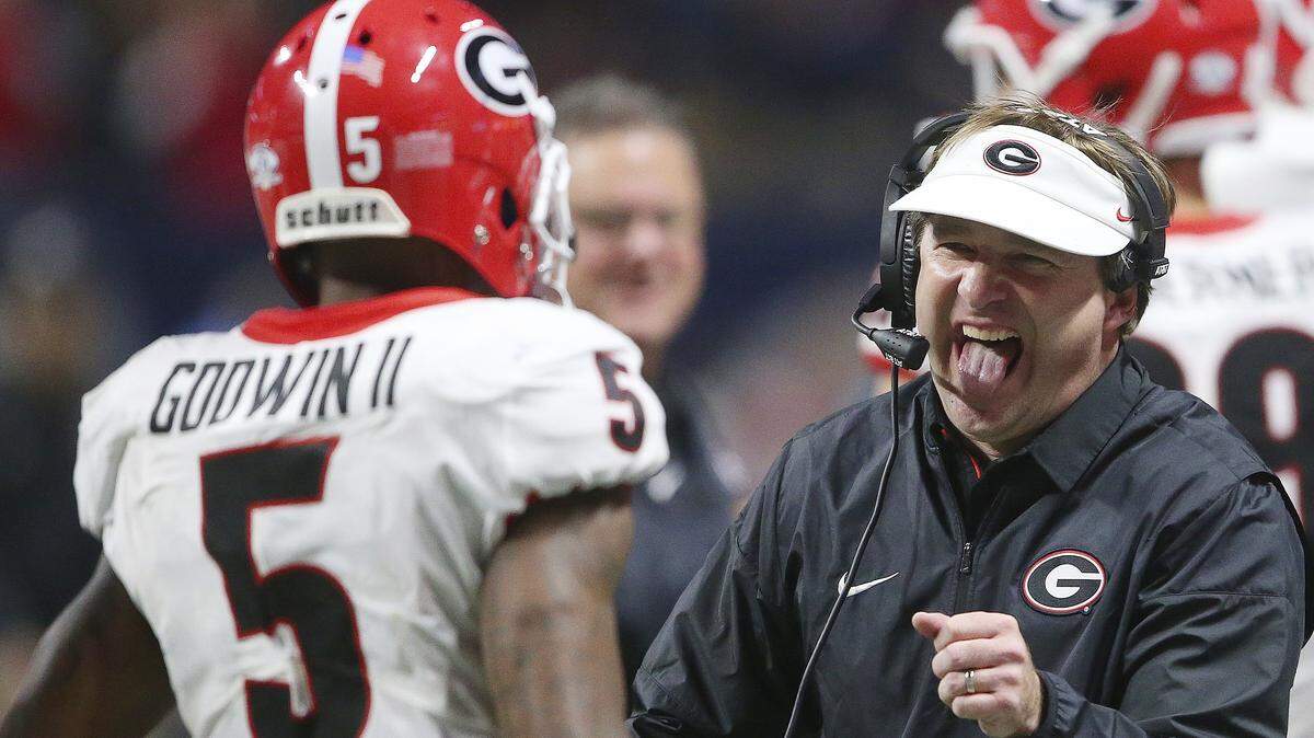 In this Dec. 2, 2017, file photo, Georgia head coach Kirby Smart reacts after Georgia wide receiver Terry Godwin (5) scored a touchdown against Auburn during the second half of the Southeastern Conference championship NCAA college football game in Atlanta