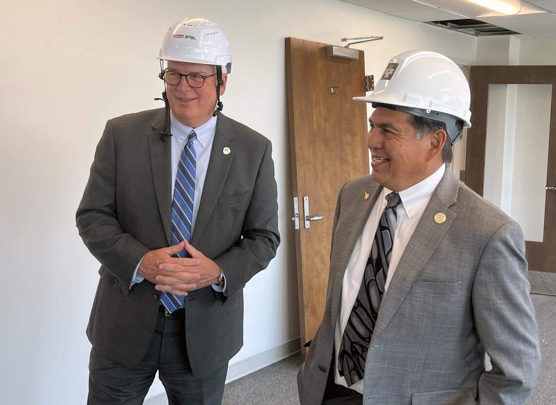 Columbus Mayor Skip Henderson, left, and Principal Chief David Hill of the Muscogee Nation, right, tour Columbus City Hall in Columbus, Georgia on Sept. 15, 2025. Officials announced during a gathering at the Springer Opera House the Muscogee Nation will have a permanent office inside city hall.