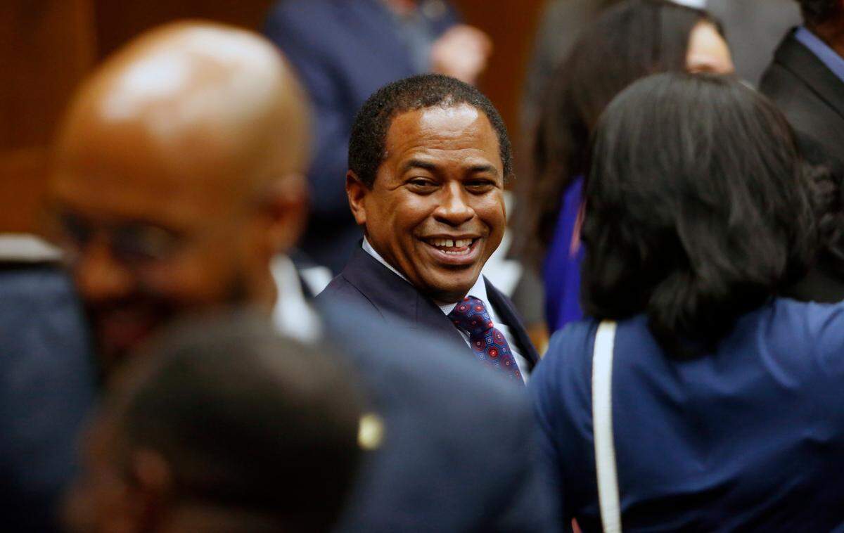 Travis Chambers greets family and friends after being sworn into Columbus City Council by Superior Court Judge Arthur L. Smith III in early July. 07/03/2024
