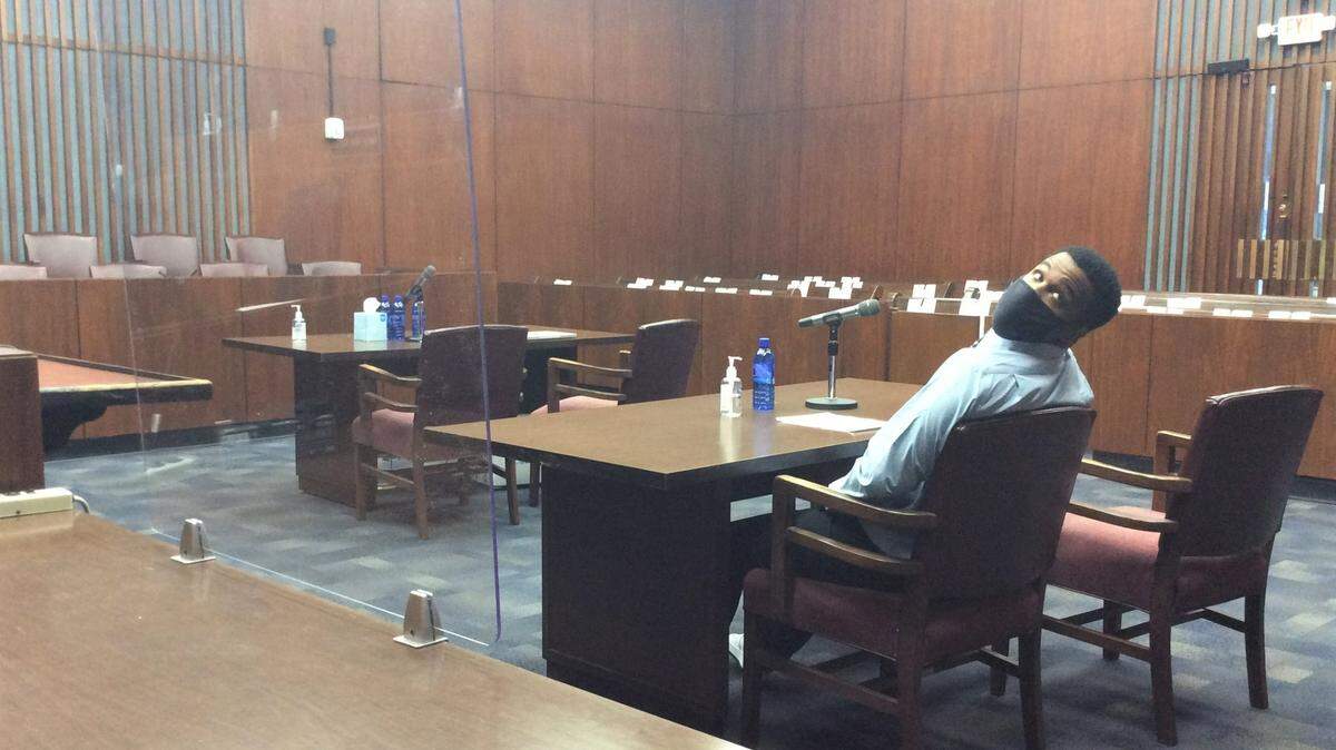 Drevon Johnson sits alone at the defense table during jury deliberations Tuesday, April 27, 2021.