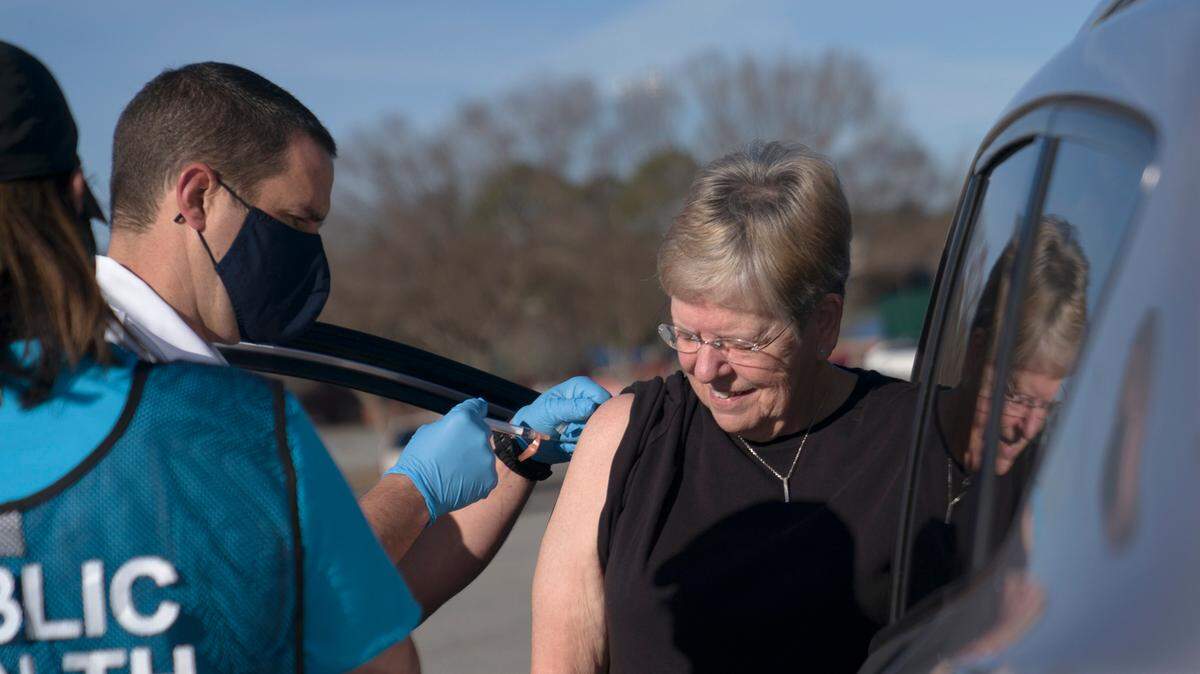 A woman receives her COVID-19 vaccine at the Civic Center in Columbus, Ga. on Saturday, Jan. 23, 2021.