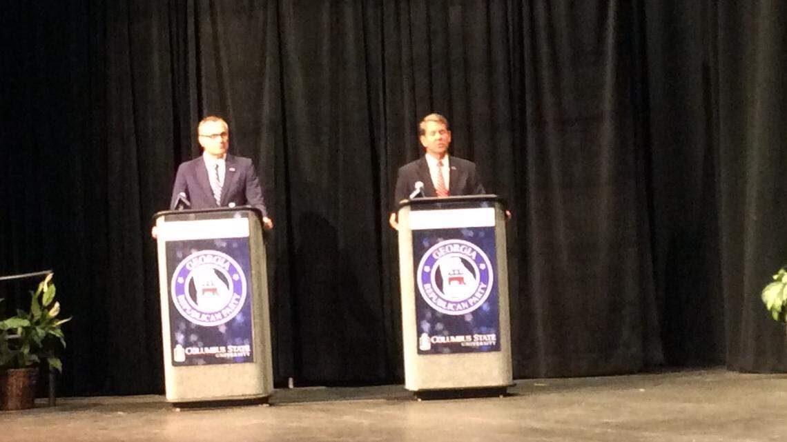 Brian Kemp and Casey Cagle trade jabs Tuesday night during Georgia governor's debate in Columbus.