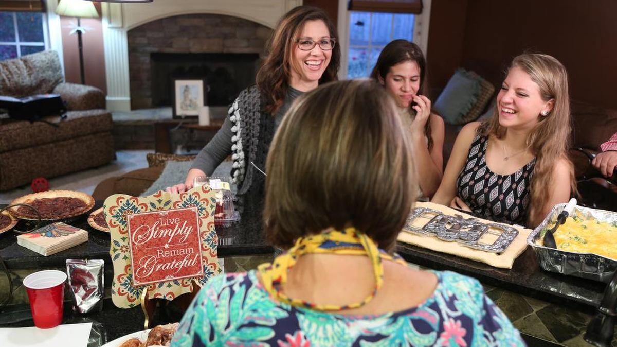 Fabiana Fierli (right), 15, an exchange student from Italy, spends her first Thanksgiving with Spano family in Columbus on Nov. 24. Fierli is a participant in St. Anne-Pacelli Catholic School’s international exchange program.