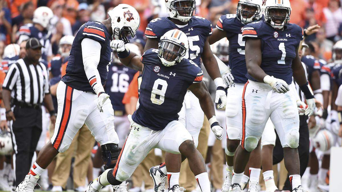 Cassanova McKinzy (8) celebrates a stop. Jacksonville State vs Auburn in Auburn, Ala. on Saturday, Sept. 12, 2015.Zach Bland/Auburn Athletics