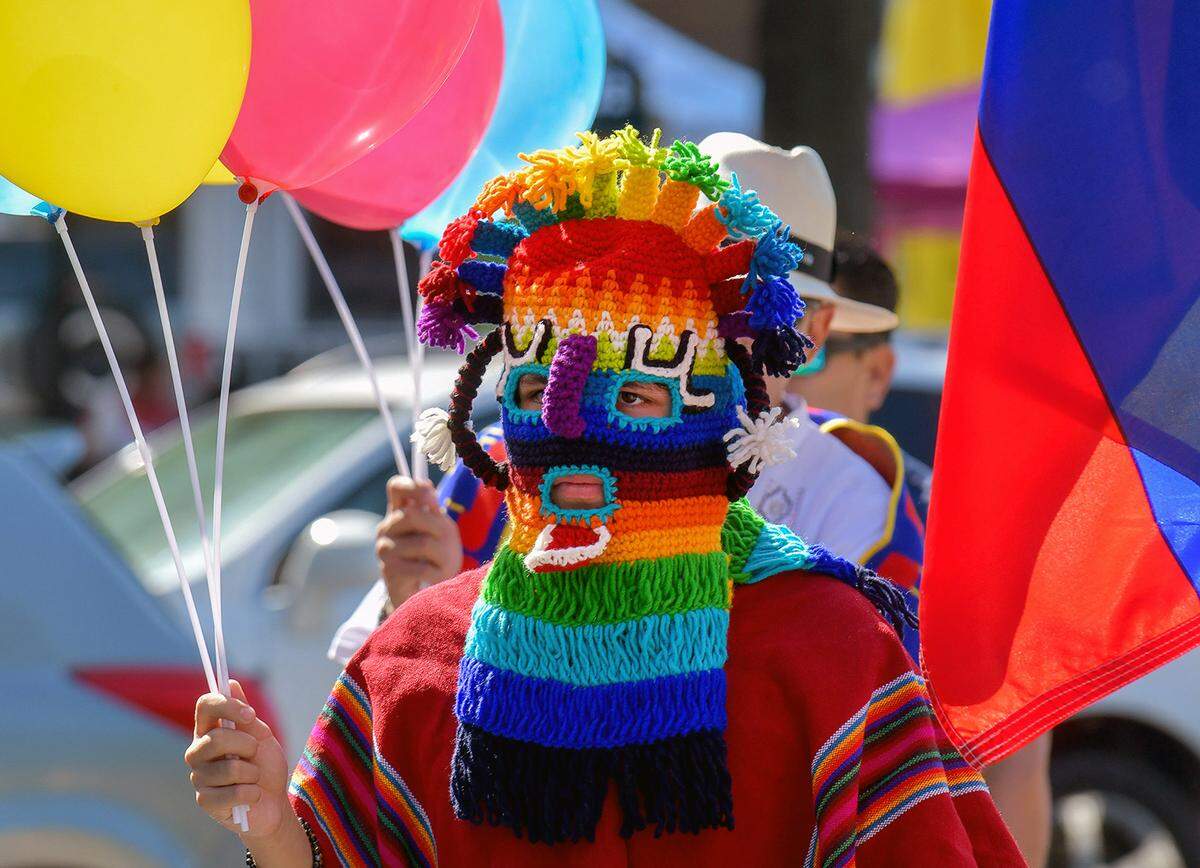 This parade participant dressed in Ecuadorian clothing and wore an Ecuadorian underworld mask in the Tri-City Latino Festival parade on Saturday morning. 09/21/2024