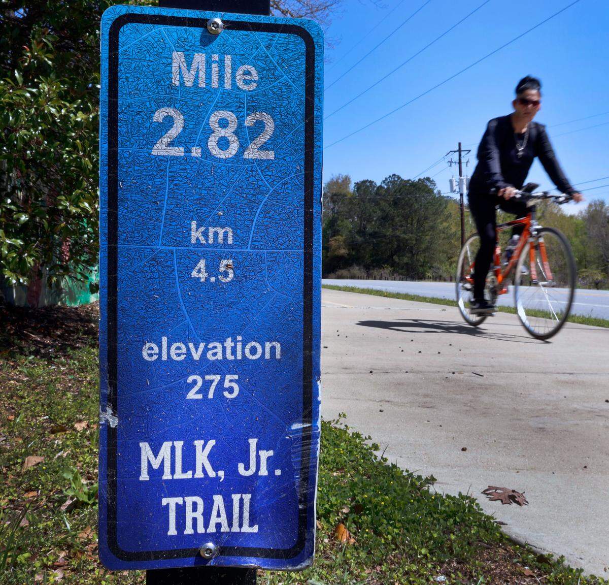 A bicyclist rides along a portion of the Dr. Martin Luther King, Jr. Outdoor Learning Trail in Columbus, Georgia. 03/28/2024