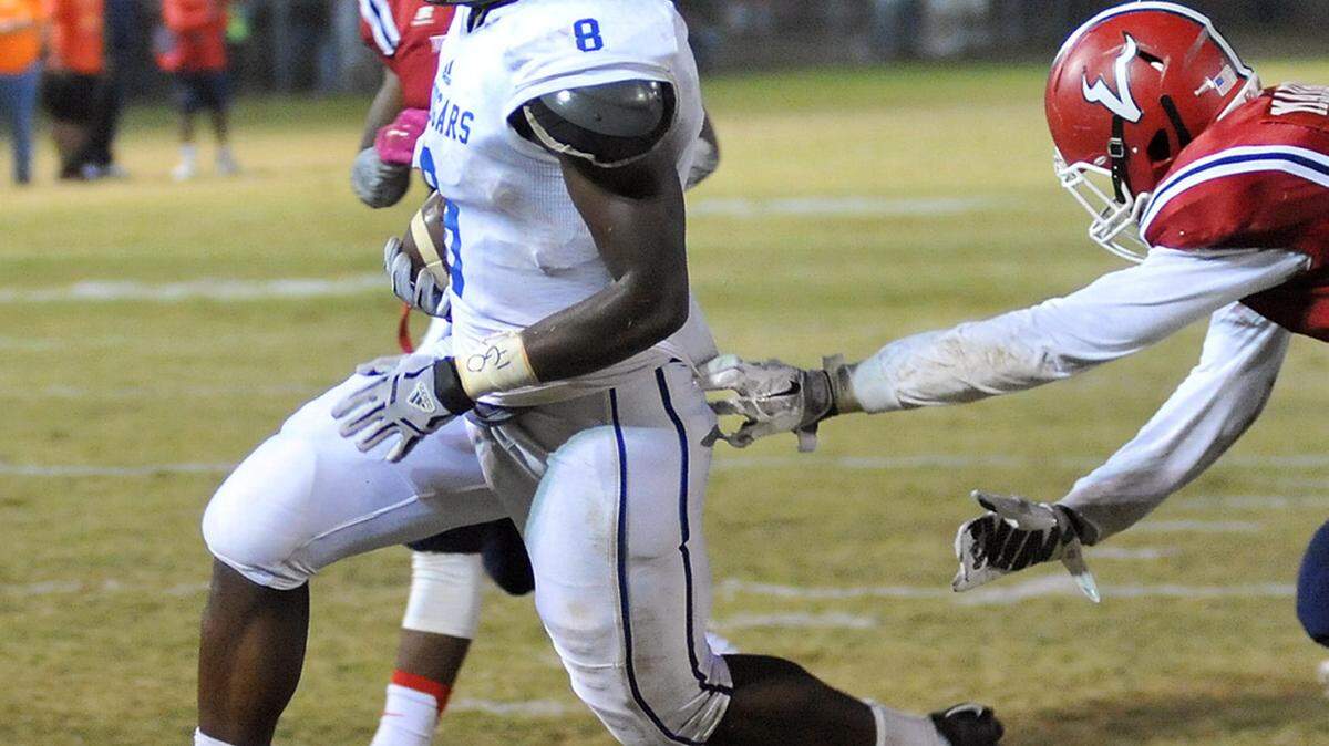 BrookstoneþÄôs Sam Ndem runs the ball in form the 4 yard line breaking past the tackle by PacelliþÄôs Mikal Marble for their first touch down of the night