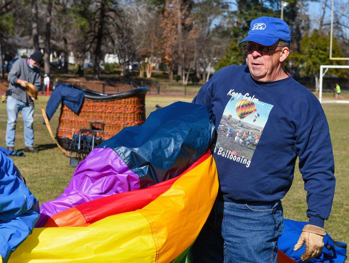 Pilot Gary Brossett, right, and co-pilot Dorinda Morpeth made an unscheduled landing in Columbus’ Lakebottom park with Brossett’s hot air balloon named “Kalos” Thursday. After taking off from Crawford, Alabama, with the intention of landing near Ladonia, Alabama, Brossett said winds forced them to come up with an alternate landing site. 01/13/2022