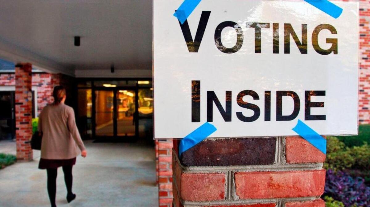 A voter walks into the precinct at Epworth United Methodist Church, 2400 Devonshire Drive in Columbus, on Election Day 2014. 