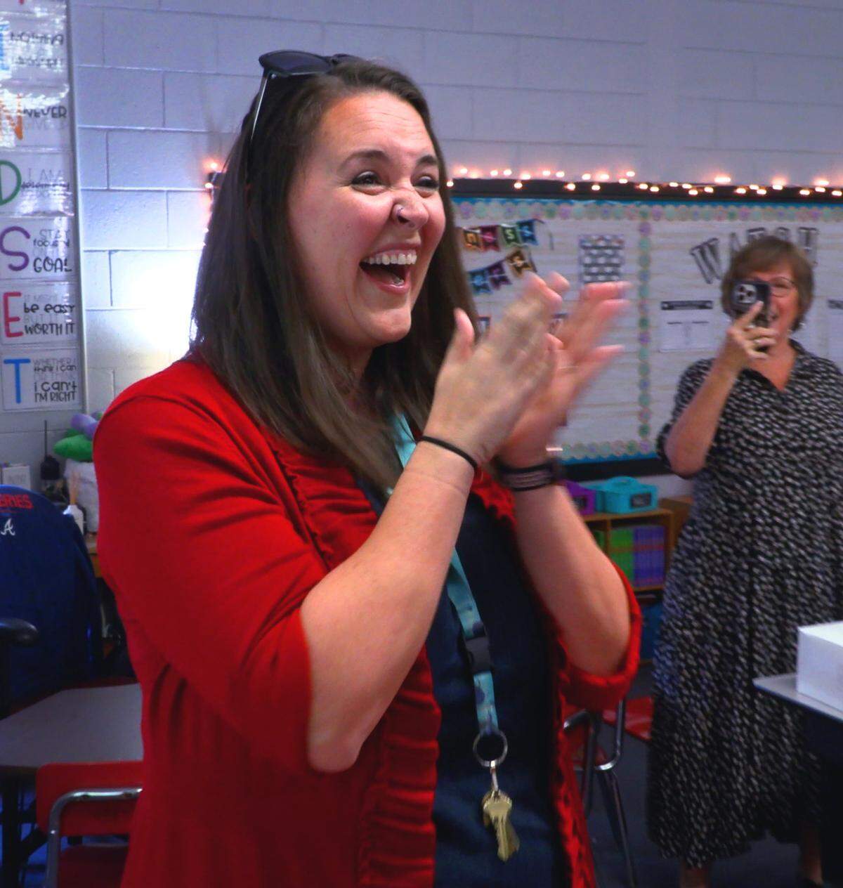 Gena Davis, a teacher at Dimon Magnet Academy, reacts after learning she is a Muscogee County School District 2022 Teacher of the Year finalist. 03/29/2022