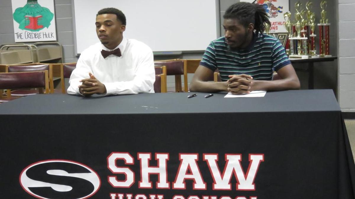 Shaw basketball players Devan Porter-Wilson and Patrick Mahone signed their letters of intent at the high school on Thursday.