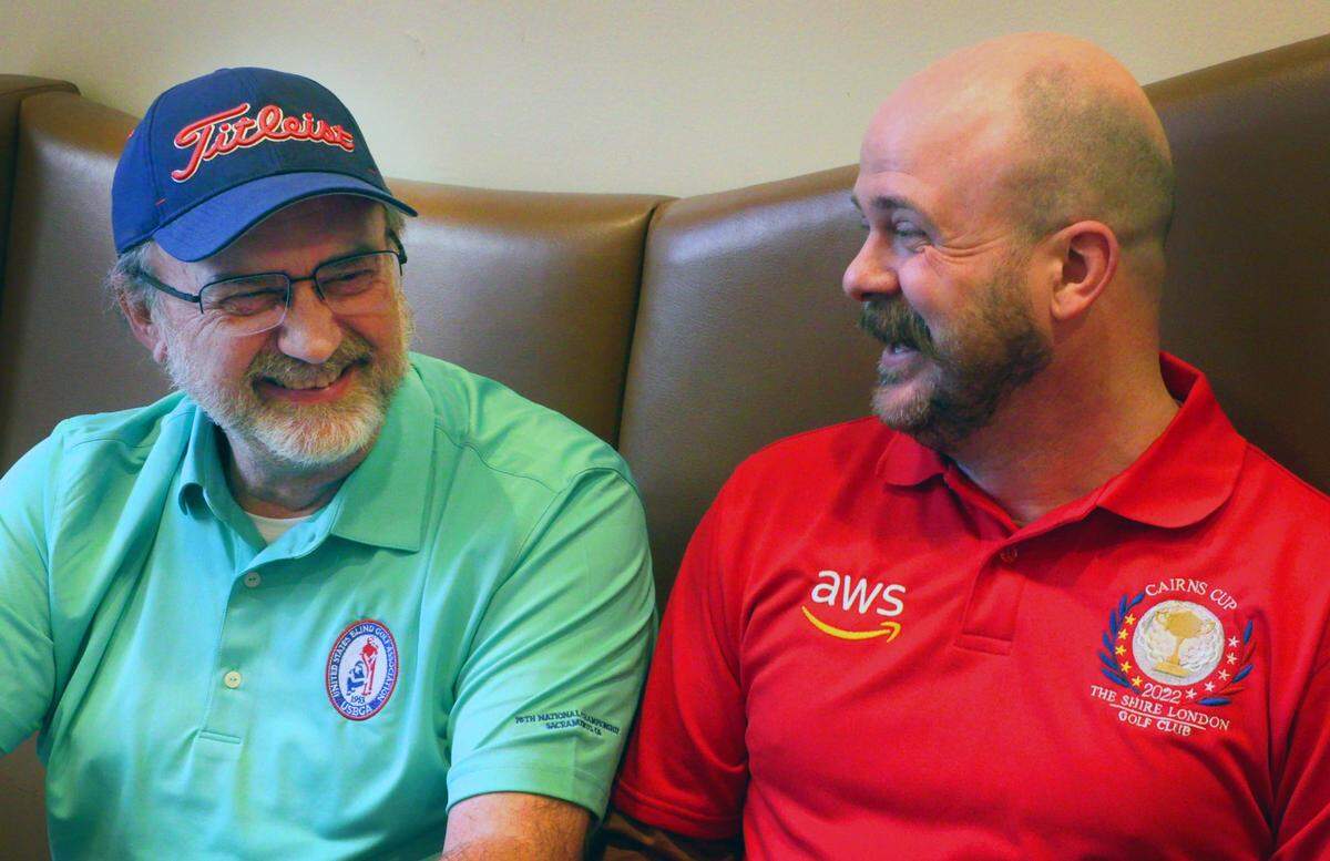 Greg Hooper, left, a golfer with the United States Blind Golf Association, and his son and coach Alan Hooper, are competing in a tournament this week at Green Island Country Club in Columbus, Georgia. 03/20/2023