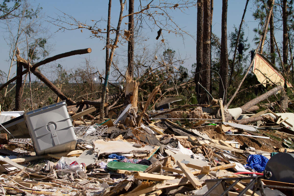 Remnants of a home lay scattered across the earth along with snapped trees and limbs on Wednesday, March 6, 2019, in Lee Co, Ala. A tornado outbreak struck the county on Sunday, March 3, 2019, and left 23 dead, others injured and property damaged.
