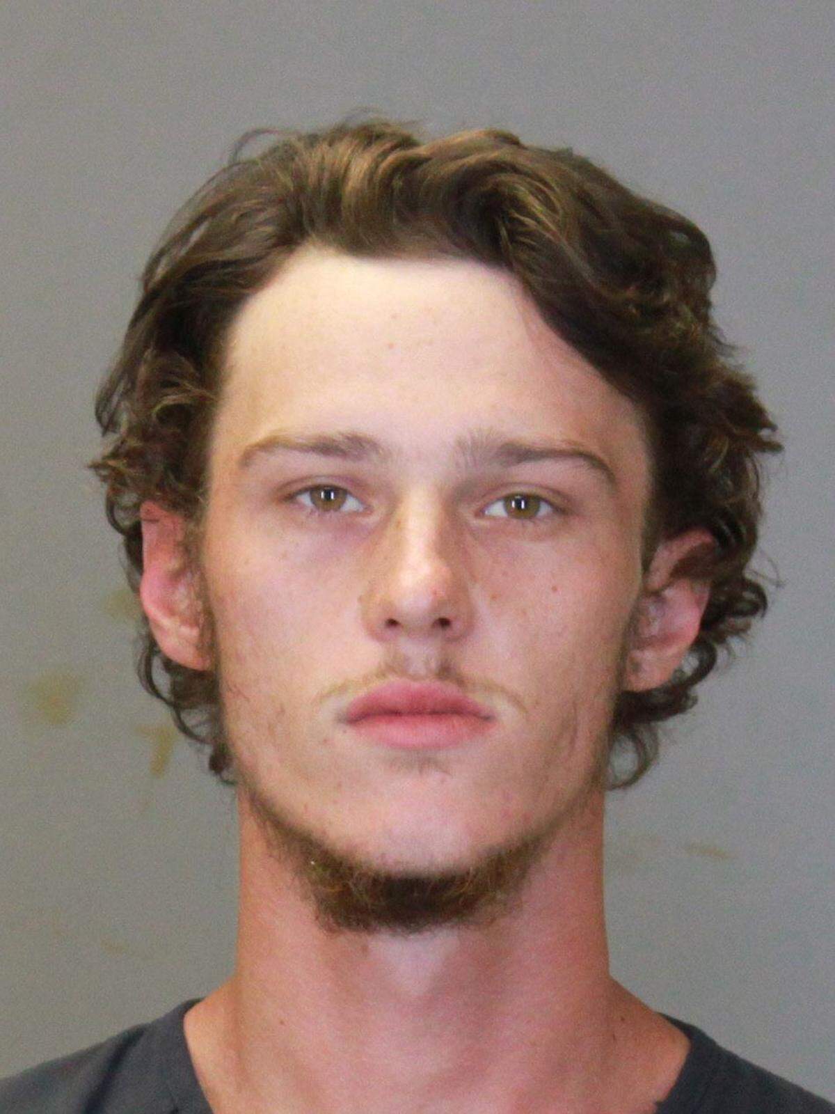 Hunter Tillis, the cousin wounded the night a Columbus police officer fatally shot Christian Redwine, was arrested Oct. 10 for threatening to shoot up a local restaurant, authorities said.