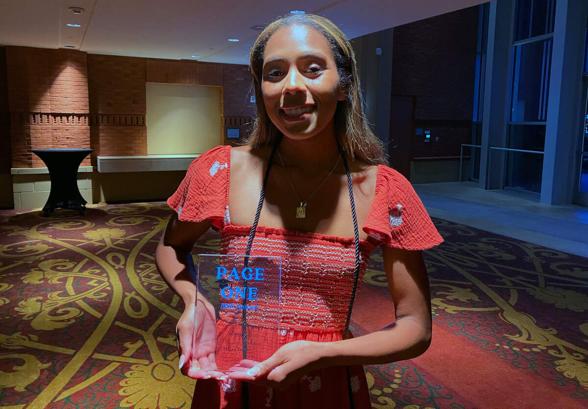 Megan Taylor of Columbus High School holds the trophy she received for winning the 2025 Page One Award in the journalism category during Tuesday night’s ceremony at the RiverCenter for the Performing Arts in downtown Columbus. 04/22/2025