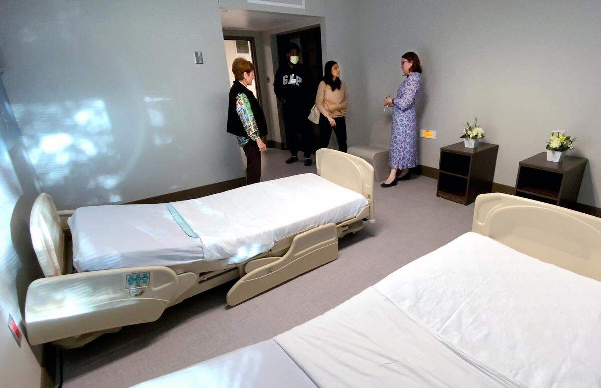 Dr. Iveta Boyanchek, right, the medical director for St. Francis-Emory Healthcare’s new Geriatric Psychiatry Unit, gives a tour of a patient room Thursday during an open house. 10/19/2022