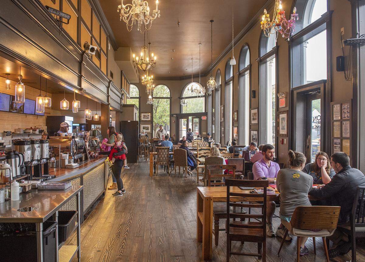 Columbus residents seek shelter and hot coffee in Iron Bank Coffee Company on rainy Saturday, January 11, 2020.