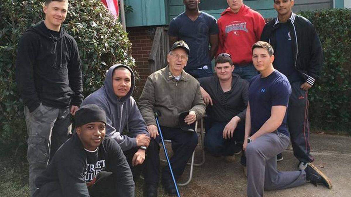 Contributed photo Retired Master Sgt. Vincent Melillo is surrounded by members of Warrior Outreach who helped with repairs around his house earlier this year. Melillo died on Christmas Eve.