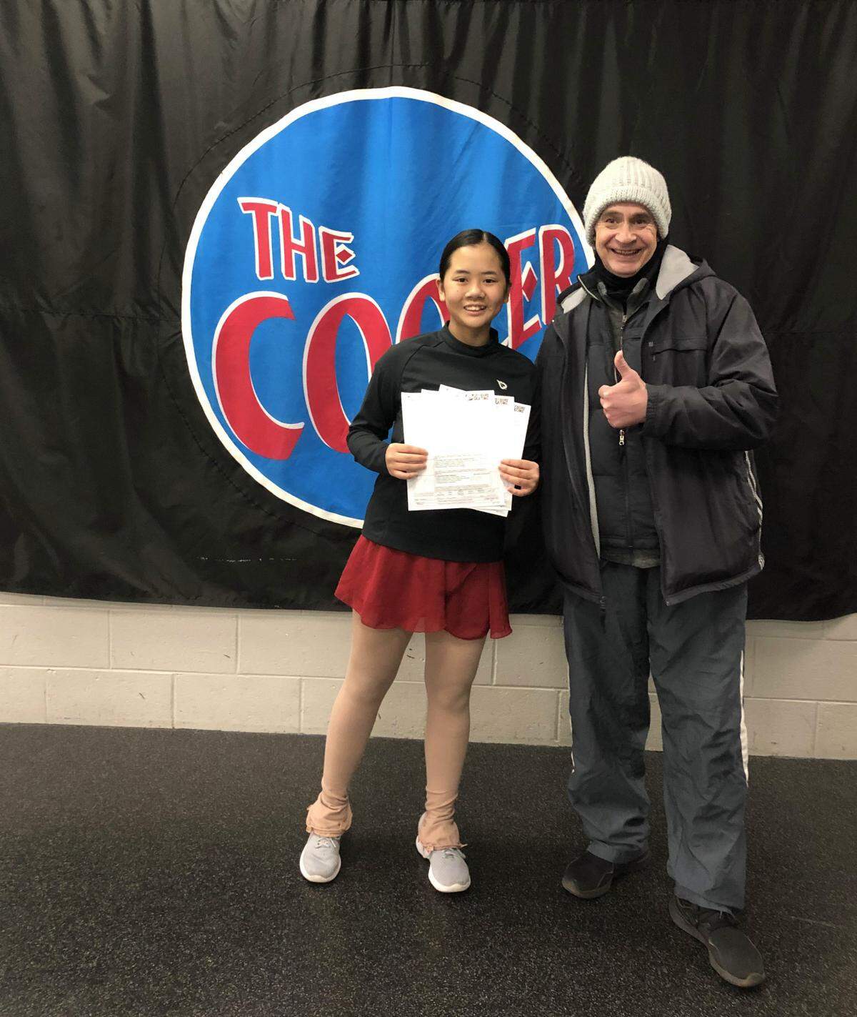 Alexandra Greenfield poses for a photograph with her coach Vladimir.