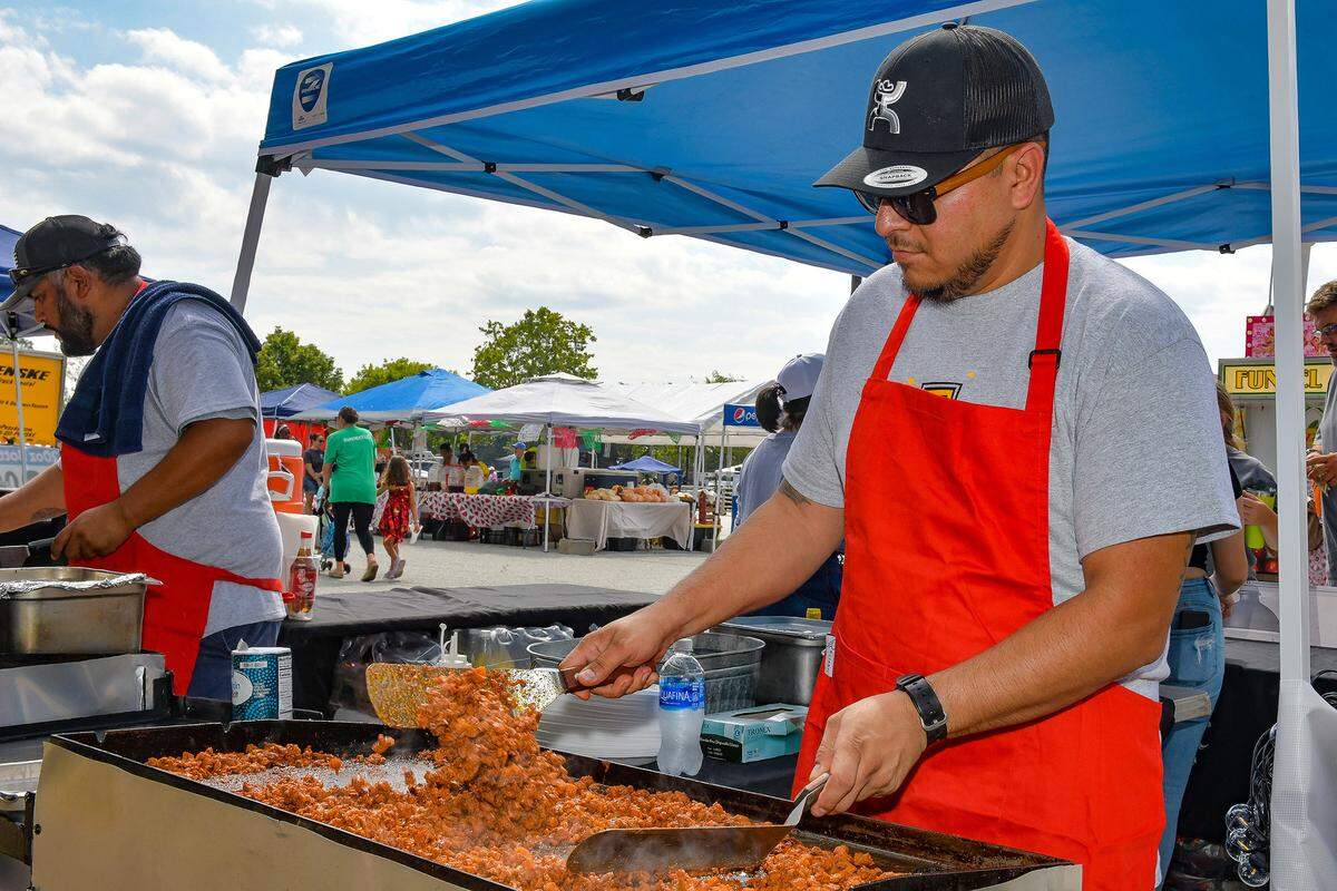 George Bautista prepares tacos al pastor during the 2022 Tri-City Latino Festival at the Columbus Civic Center in Columbus, Georgia. 09/17/2022