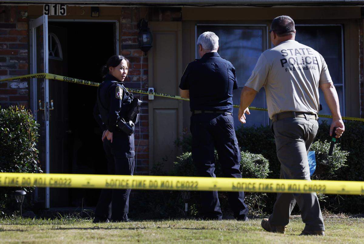 Law enforcement officers are at 915 Wehring Lane in Phenix City the morning of Oct. 14, 2025, after four members of a family died in a house fire the previous night, according to Russell County Coroner Arthur Sumbry Jr. The cause of death is due to “possible smoke inhalation,” Sumbry said., and the cause of the fire is under investigation.