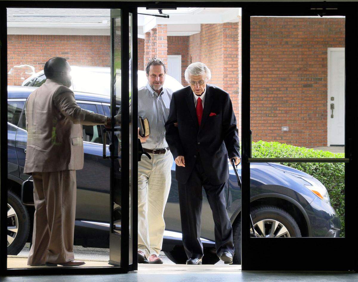 Pastor Tony Dickerson, right, of Pinehurst Baptist Church in Columbus, Georgia enters church for a recent Sunday morning service.
