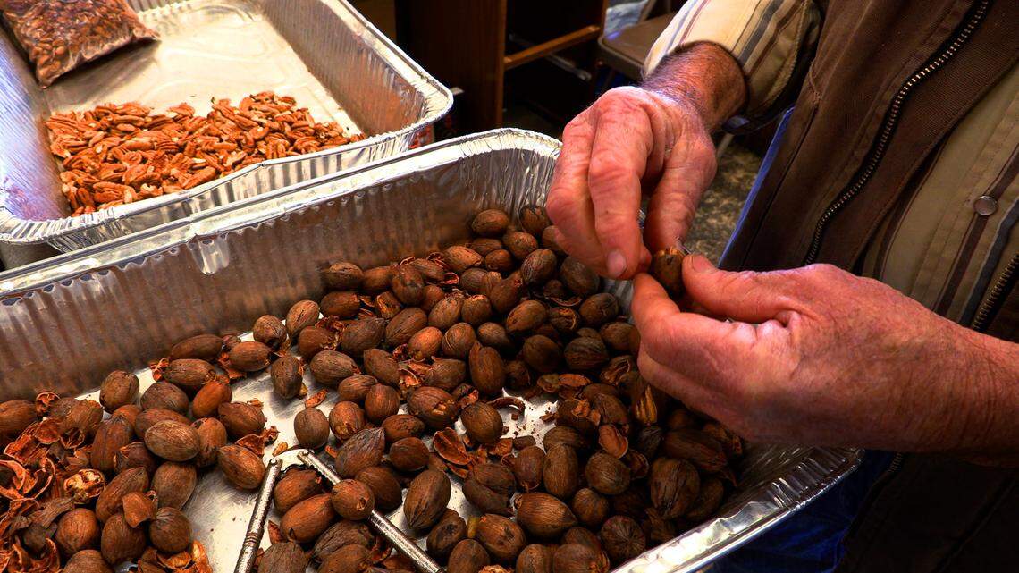 Larry Grier shells pecans by hand behind the counter at the former Fat Boy’s Farmer’s Market on Veterans Parkway in Columbus, Georgia. Grier has purchased the former Fat Boy’s Farmer’s Market and also runs his own farm in Buena Vista.