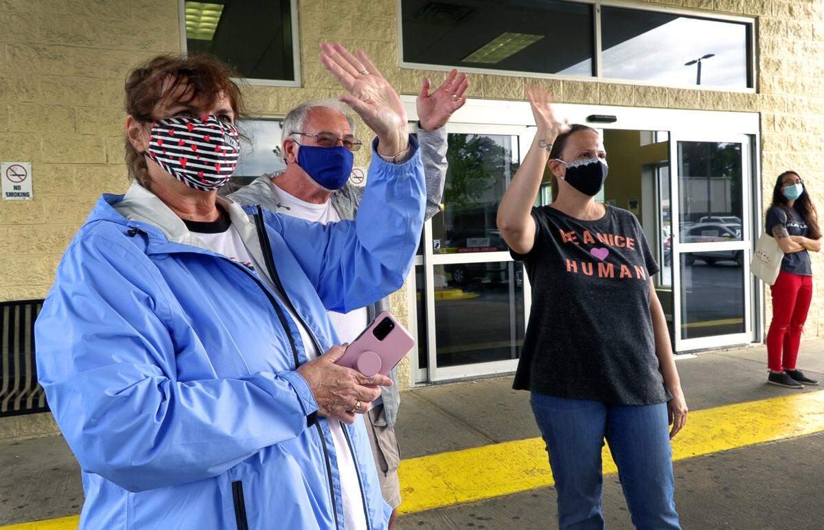 Members of Paz Amigos wave goodbye as men recently released from the Stewart Detention Center leave on a shuttle van from Groome Transportation in Columbus, Georgia on their way to Hartsfield-Jackson Atlanta International Airport.