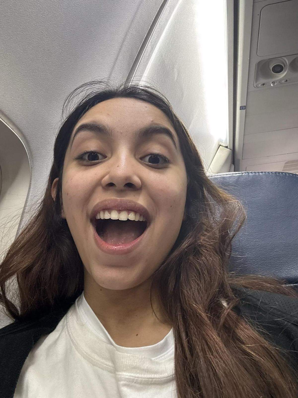 Allison Bustillo, 20, was detained by ICE in February 2025 after the FBI and other law enforcement raided her family’s apartment in Charlotte, North Carolina, looking for a former tenant. Bustillo was detained in Stewart Detention Center in Lumpkin, Georgia, for over six months. After a judge agreed to allow her to self-deport, Bustillo took a selfie on the commercial plane returning her to Honduras.