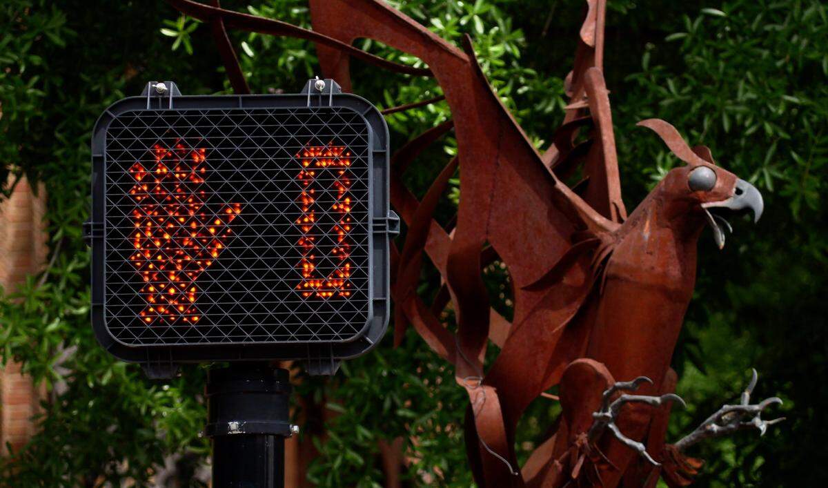 A crosswalk light in downtown Columbus indicates there is no time left to safely cross the intersection. As the number of pedestrians and motorists continues to rise in downtown Columbus, officials are looking for various ways to make the area safer for all who use it.