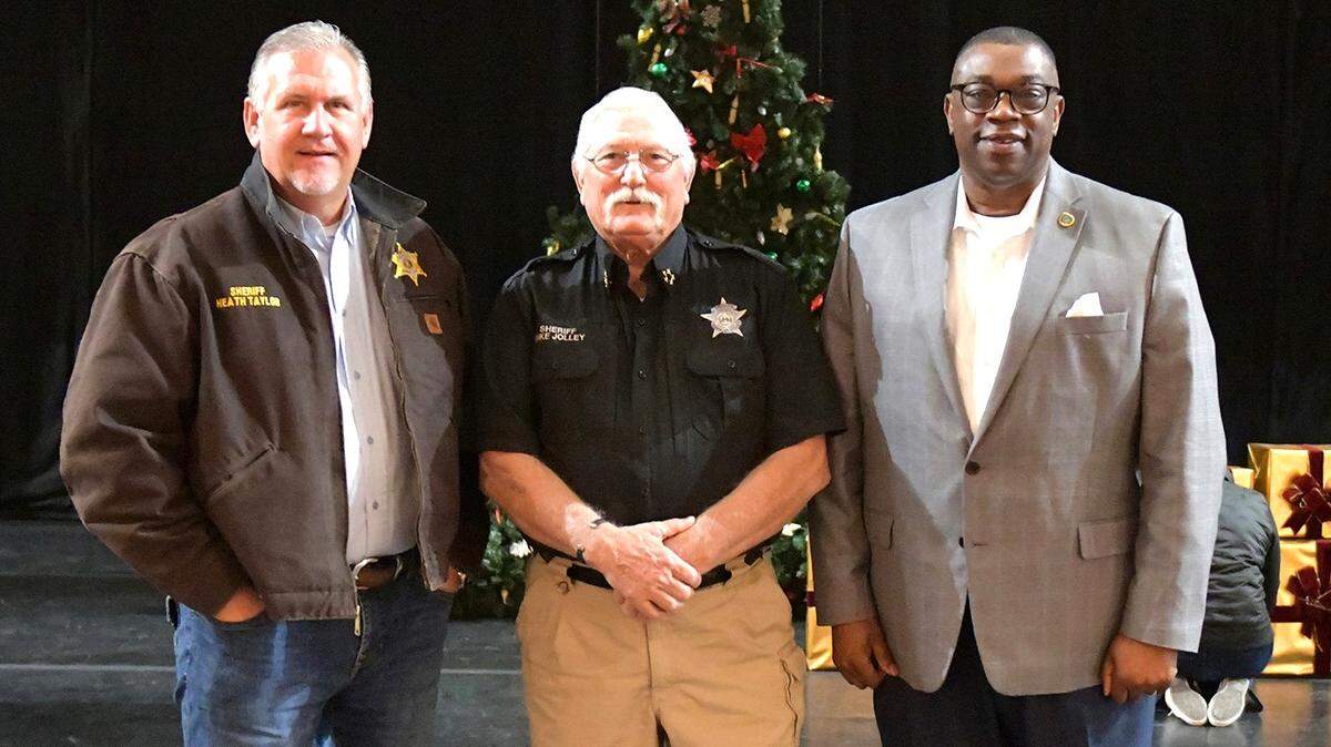 From left, Russell County Sheriff Heath Taylor, Harris County Sheriff Mike Jolley and Muscogee County Sheriff Greg Countryman are on stage at the RiverCenter for the Performing Arts in Columbus during rehearsal Dec. 12, 2023, for their roles in the Columbus Ballet’s production of “The Nutcracker” Dec. 16 and 17.