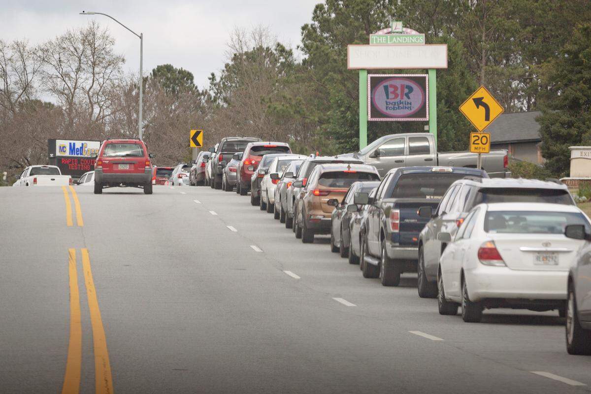 With passengers waiting to receive a COVID-19 test, a line of cars builds at MedCare on Whitesville Rd in Columbus, Ga. on Jan. 3, 2022.