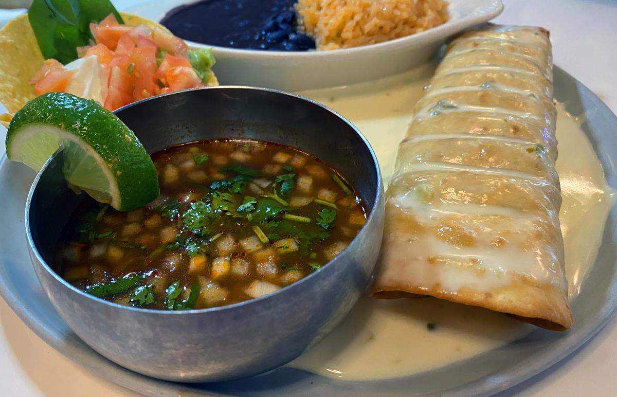 Ledger-Enquirer visual journalist Mike Haskey ordered the Birria Chimichanga at Me Encanta Modern Mexican Cuisine in downtown Columbus on Dec. 2, 2025.