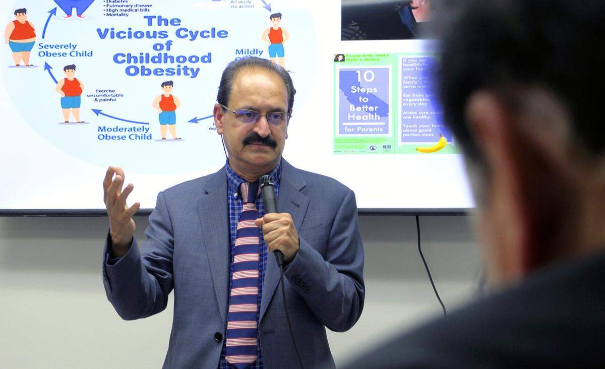 Dr. Bantwal Baliga, an endocrinologist, speaks during the grand opening of the Chattahoochee Institute for Wellness, Longevity and Weight Management in Columbus, Georgia. Baliga, his wife, Dr. Prathibha Baliga who specializes in family medicine, and Dr. Mallika Thiruppathi have partnered to open the practice.