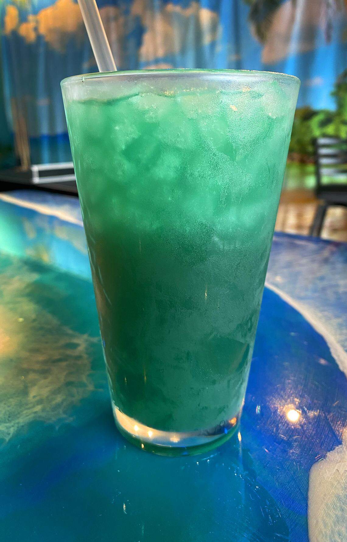 Deep Roots Kava Bar offers a variety of drinks, including this green kratom drink with blue raspberry, pictured Aug. 8, 2025. The bar is at 2505 Airport Thruway, Suite K, in Columbus.