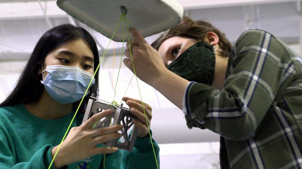 Michelle Pham, left, and Cora Wilcox,right, both seniors at Columbus, work on a satellite project recently at the Muscogee County School District’s Steve Butler STEAM Center.