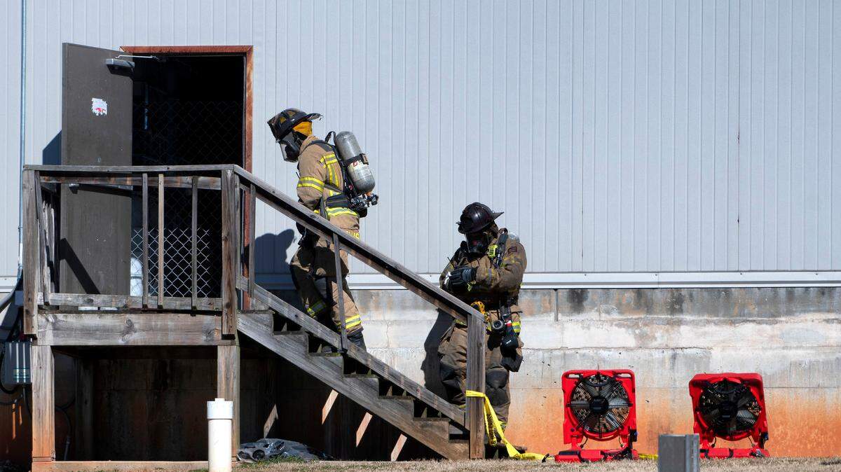 FILE - In this Jan. 29, 2021, file photo, Hall County firefighters enter a back door at Foundation Food Group in Gainesville, Ga., the day after six people were killed following a liquid nitrogen leak at the plant. The U.S. Occupational Safety and Health Administration on Friday, July 23, 2021, proposed $1 million in fines against Foundation Food Group and three other companies for workplace safety violations related to the deaths. (Scott Rogers/The Times via AP, File)