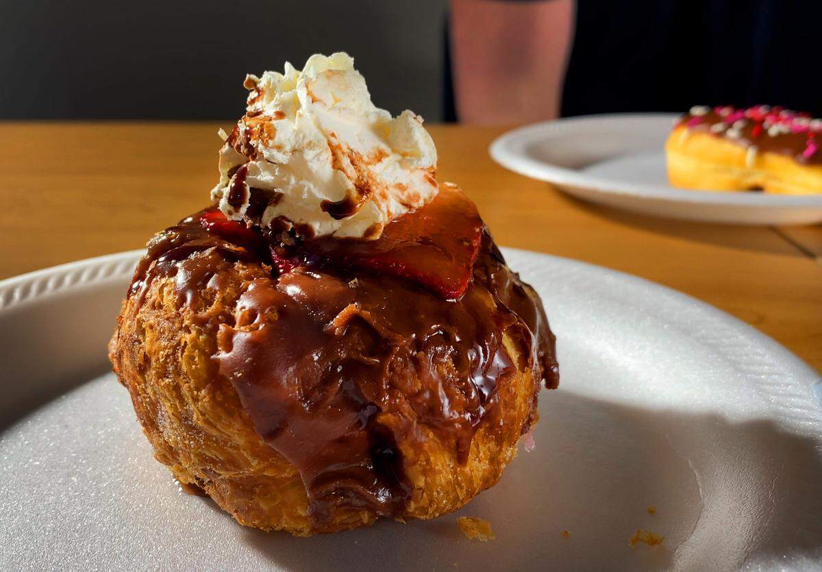 Ledger-Enquirer reporter Kelby Hutchison chose the doughnut from Parlor Doughnuts as his favorite Valentine’s Day doughnut because of its uniqueness and overall flavor profile. “The chocolate covered strawberries tasted amazing. The doughnut itself was light and fluffy and the whipped creme on top brought it all together,” Hutchison wrote.