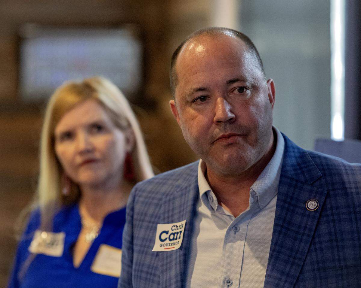 Georgia Attorney General and Republican gubernatorial candidate Chris Carr and his wife, Joan, make a campaign stop May 13, 2026, in Columbus at The Office Sports Bar & Grill.