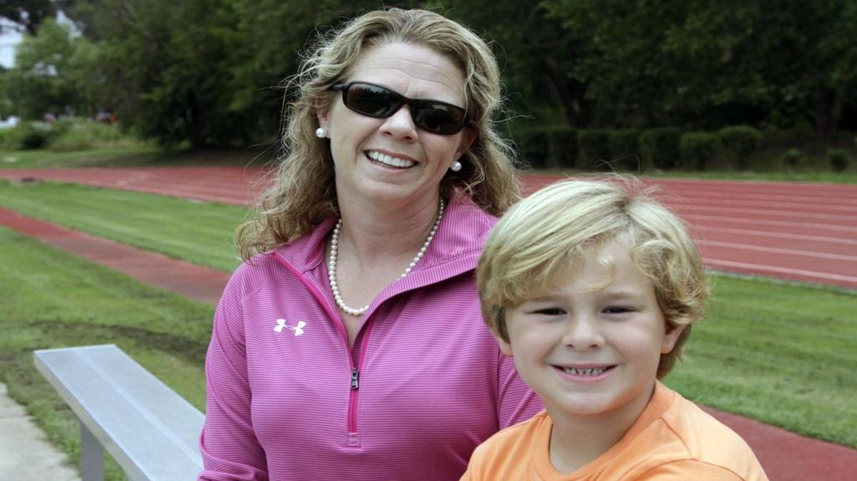 Smiths Station’s Cassidy Stecenko, here with her son John David, is the All-Bi-City Girls Track of the Year.