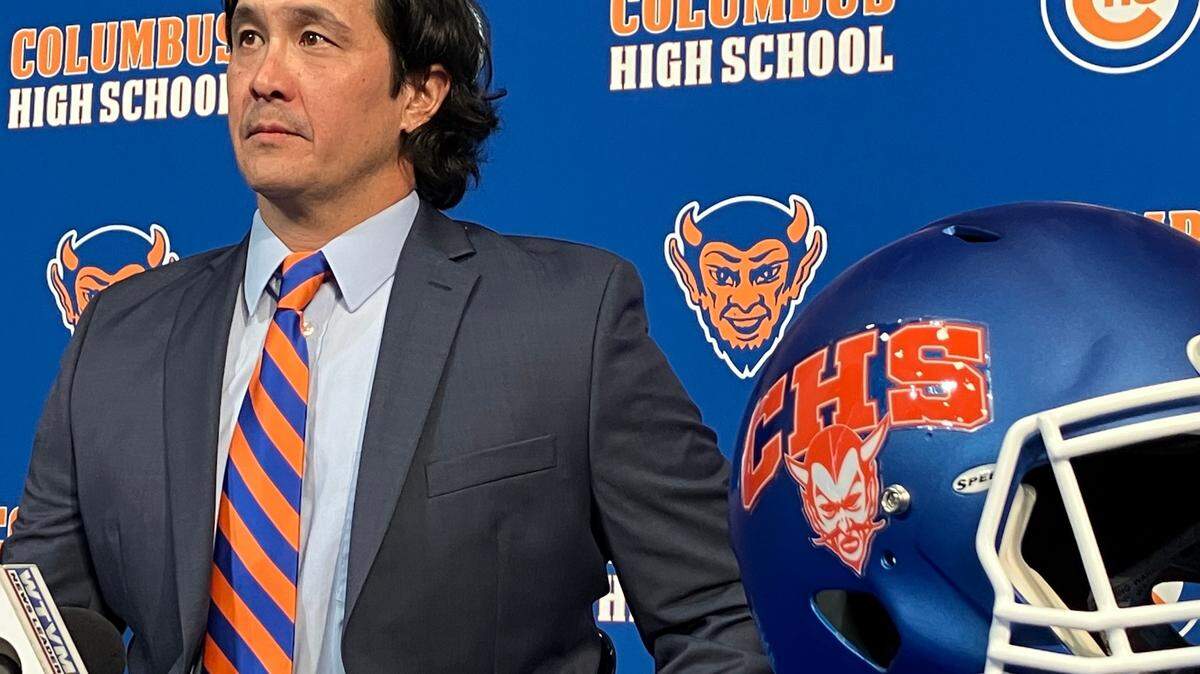 Robert “Bob” Peters speaks to reporters Jan. 31, 2024, at the news conference in the Columbus High School auditorium announcing his promotion from offensive coordinator to head coach of the football team.