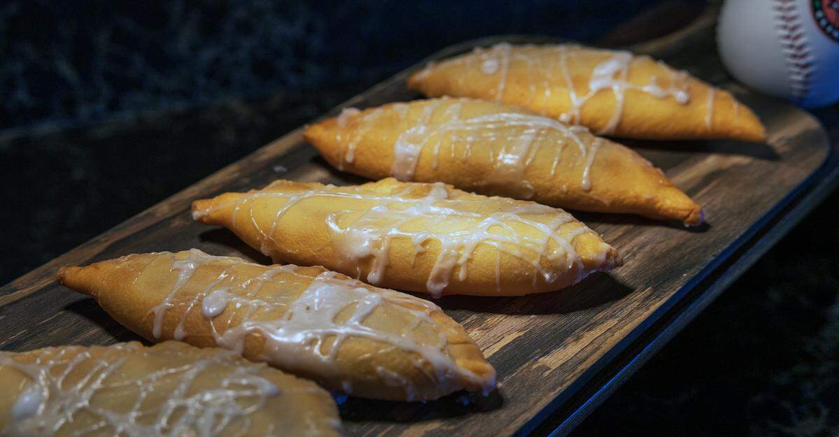 Peach hand pies with drizzled icing, pictured March 19, 2026, will be on the menu during Columbus Clingstones home games at Synovus Park this season.