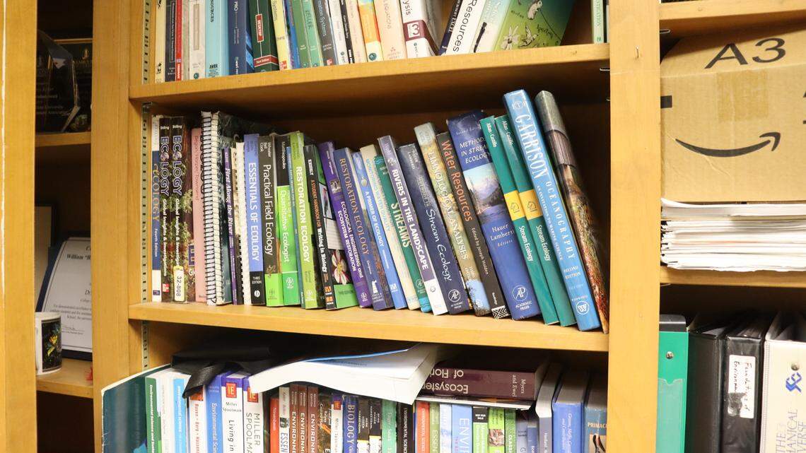 Environmental science books along Troy Keller’s wall in his office at Columbus State University.