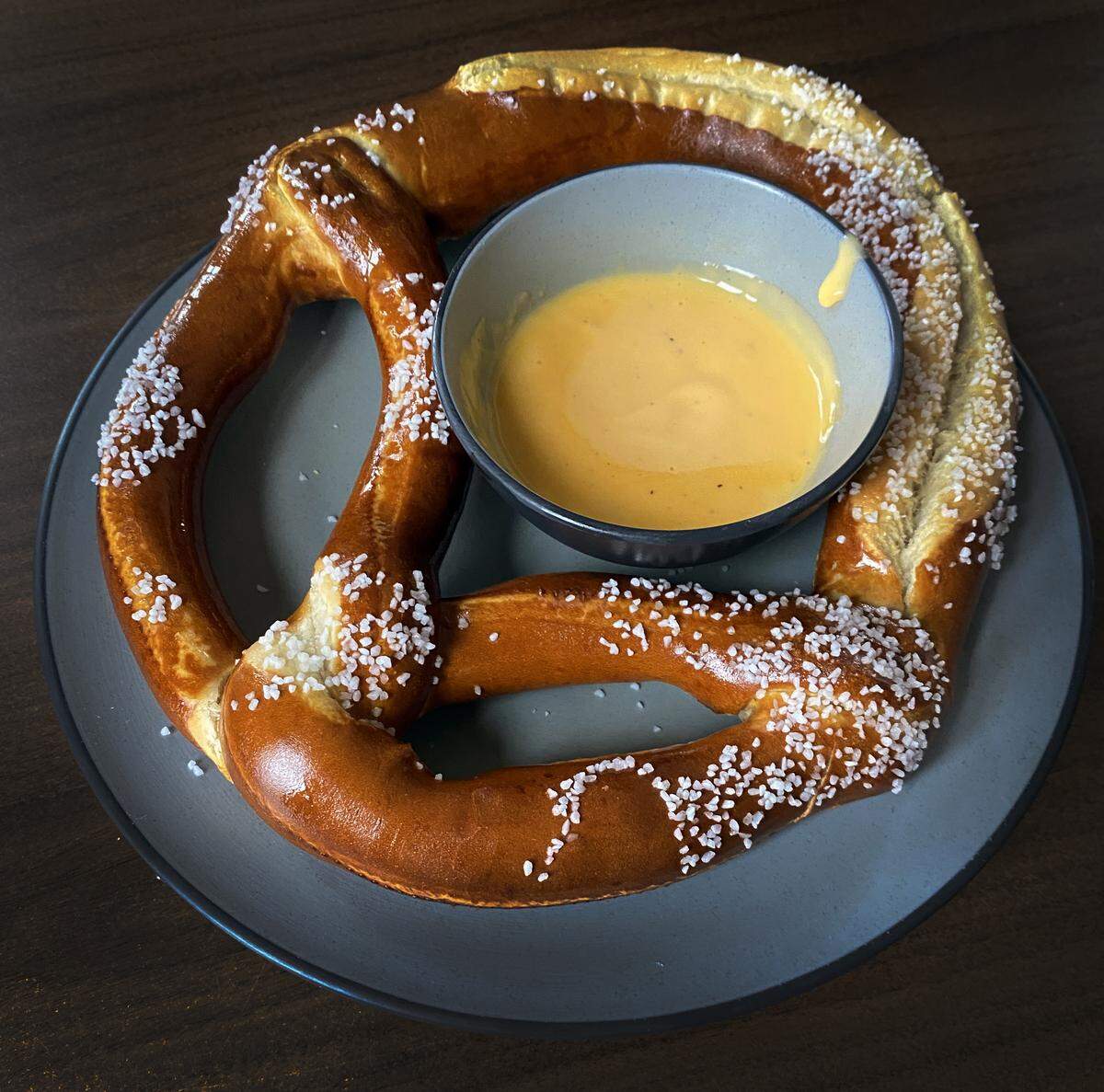 Ledger-Enquirer reporter Kelby Hutchison tried some German food, including this pretzel with beer cheese, at The Schnitzel Lot/German Food Gifts & More in Phenix City.