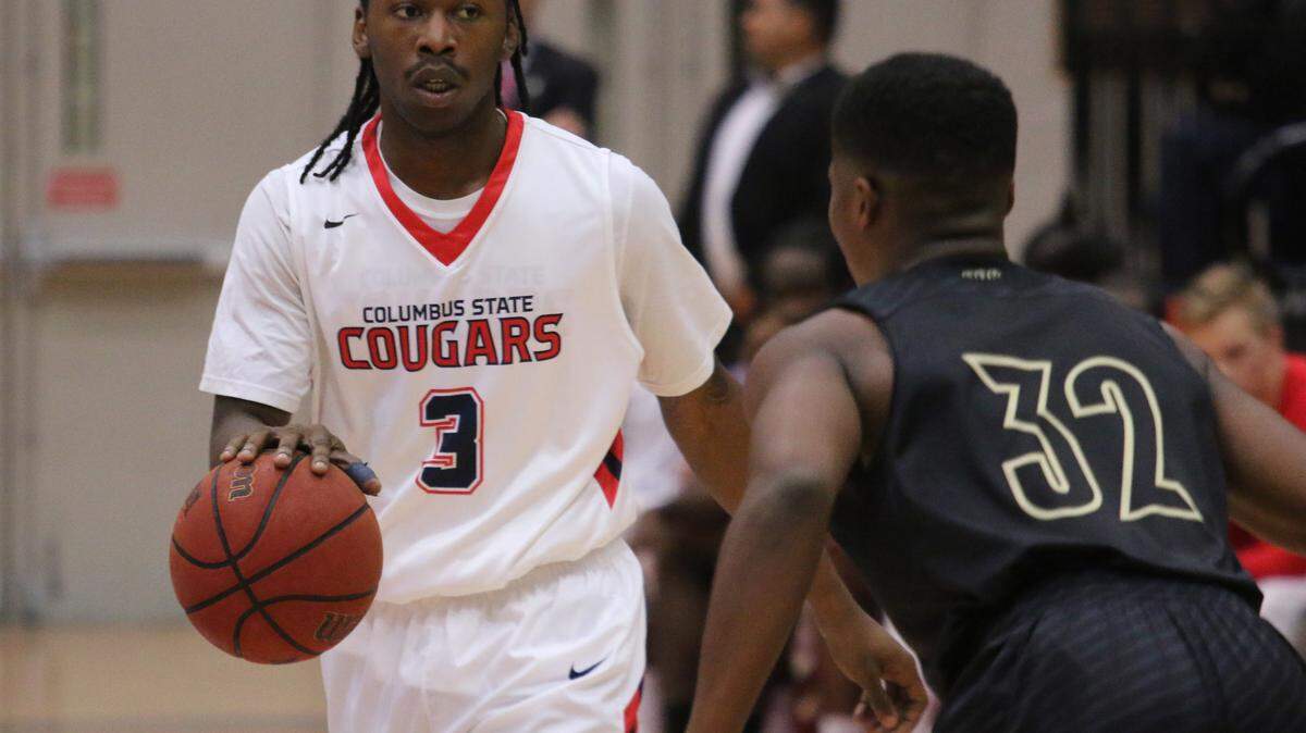 Columbus State guard Cam Baker surveys the offense in the first half of the team's Peach Belt Conference opener on Thursday at the Lumpkin Center. DAVID MITCHELL/dmitchell@ledger-enquirer.com