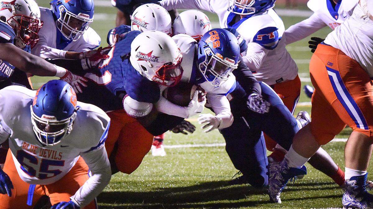 Columbus’ Tre Peterson carries for 4 yards and a touchdown in the first quarter of Friday night’s game against Northside at Kinnett Stadium, November 2, 2018.