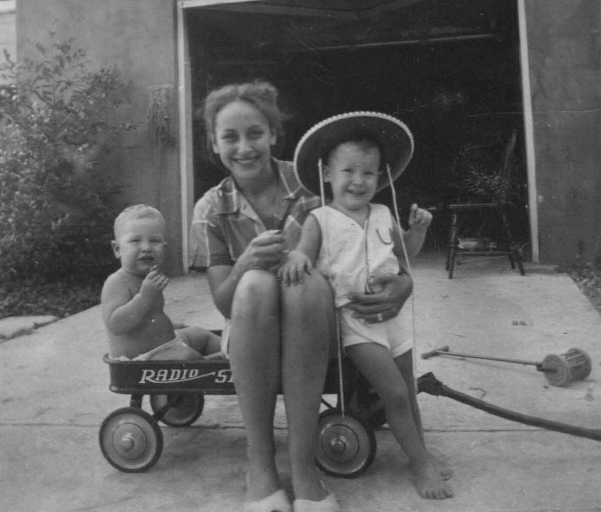 Steve Moore, left, with his mother and older brother, Greg, at home in Auburn, Alabama, while his father was fighting in the Korean War.