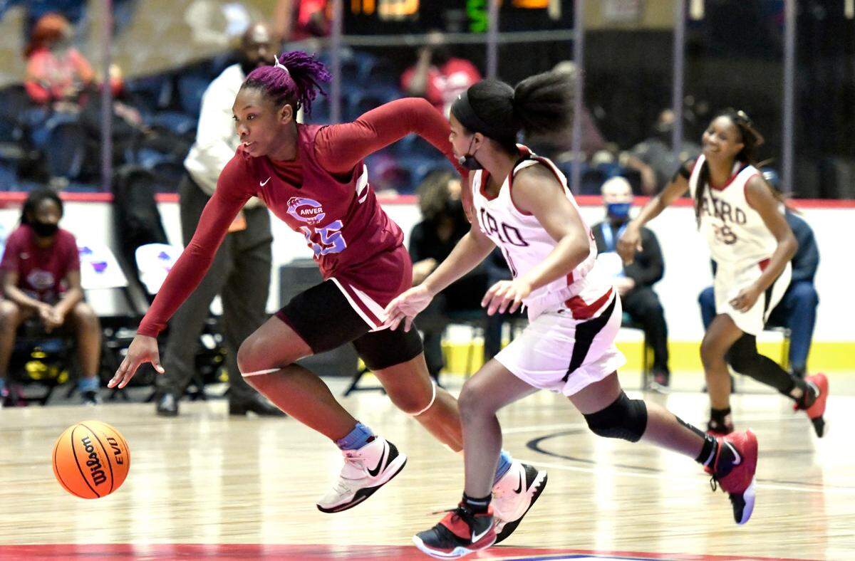 CarverÕs Kionna Gaines (15) drives the ball up court after stealing the ball during the TigersÕ GHSA 4A State Championship game against Cairo Wednesday in Macon.