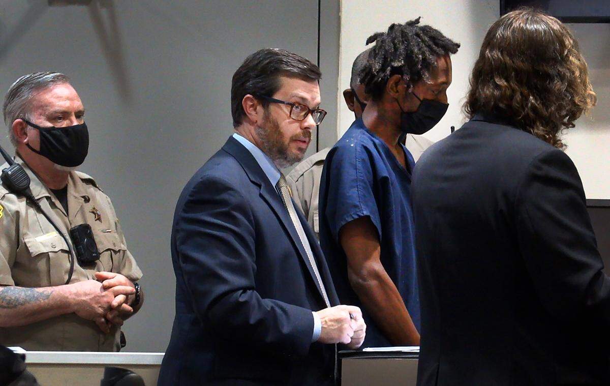 Public defender Moffett Flournoy, center, represents Donnell Russell, second from right, during a preliminary hearing Thursday morning in Columbus Recorder’s Court in Columbus, Georgia. 04/21/2022