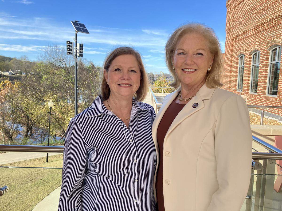 Teddie Ussery, left, is a Columbus State University Foundation Board of Trustees member and former chair. She retired from Synovus as a senior vice president and founded Family Office Matters. She poses in November 2025 with her sister Penny Elkins on the balcony of the Mercer University School of Medicine building in Columbus. Elkins will become president of Mercer on Jan. 1.